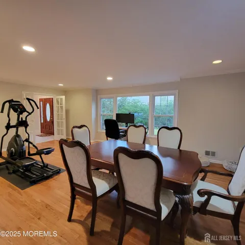 a view of a dining room with furniture window and outside view