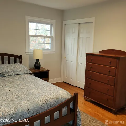 a bed room with a bed and a dresser