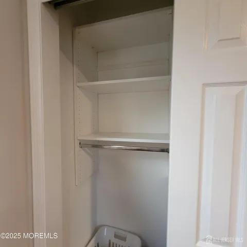 a view of an empty walk in closet