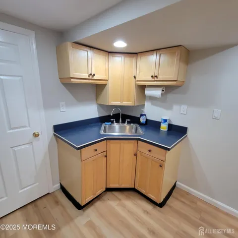 a kitchen with stainless steel appliances a sink a stove and cabinets