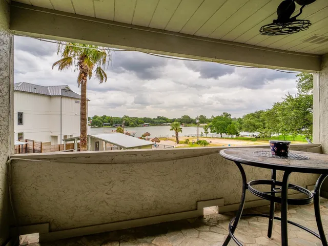 a view of a chairs and table in patio