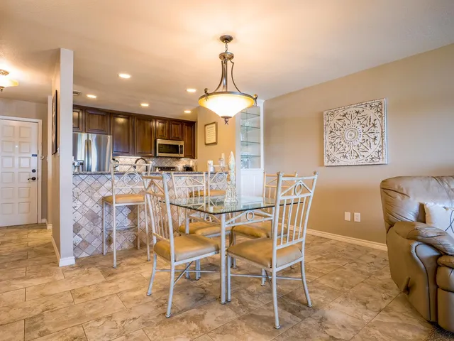 a dining room with furniture and window