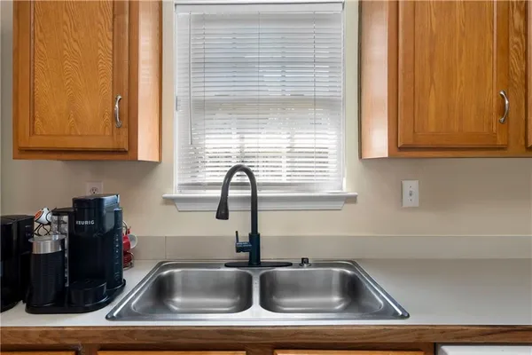 a bathroom with a sink and a window