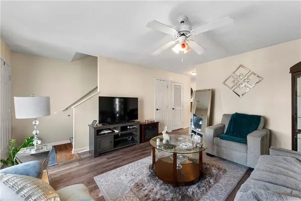a living room with furniture and a flat screen tv