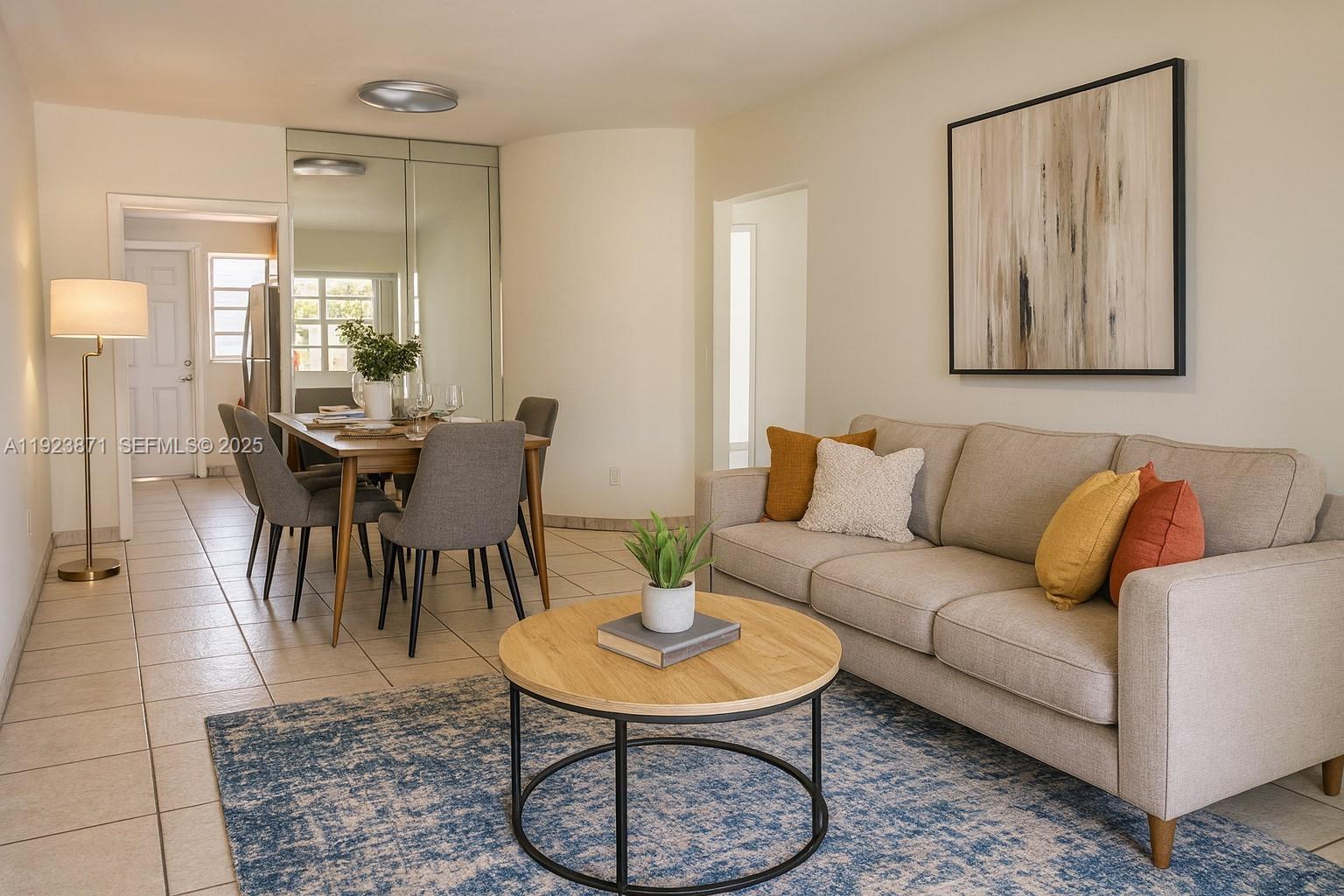 a living room with furniture a table and a painting