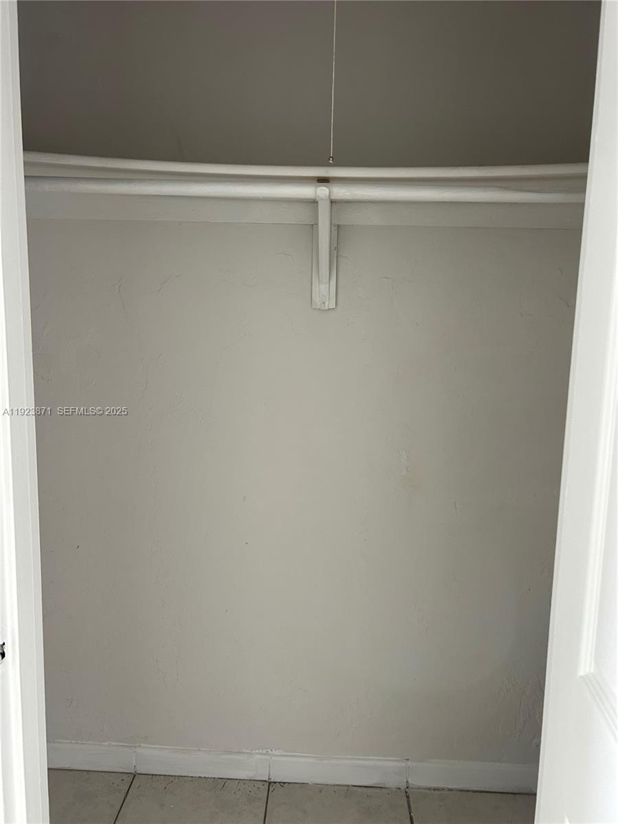 3400 Southwest 9th Terrace, Unit 2B Miami, FL 33135 - Photo 13 of 25 a view of a closet with wooden floor