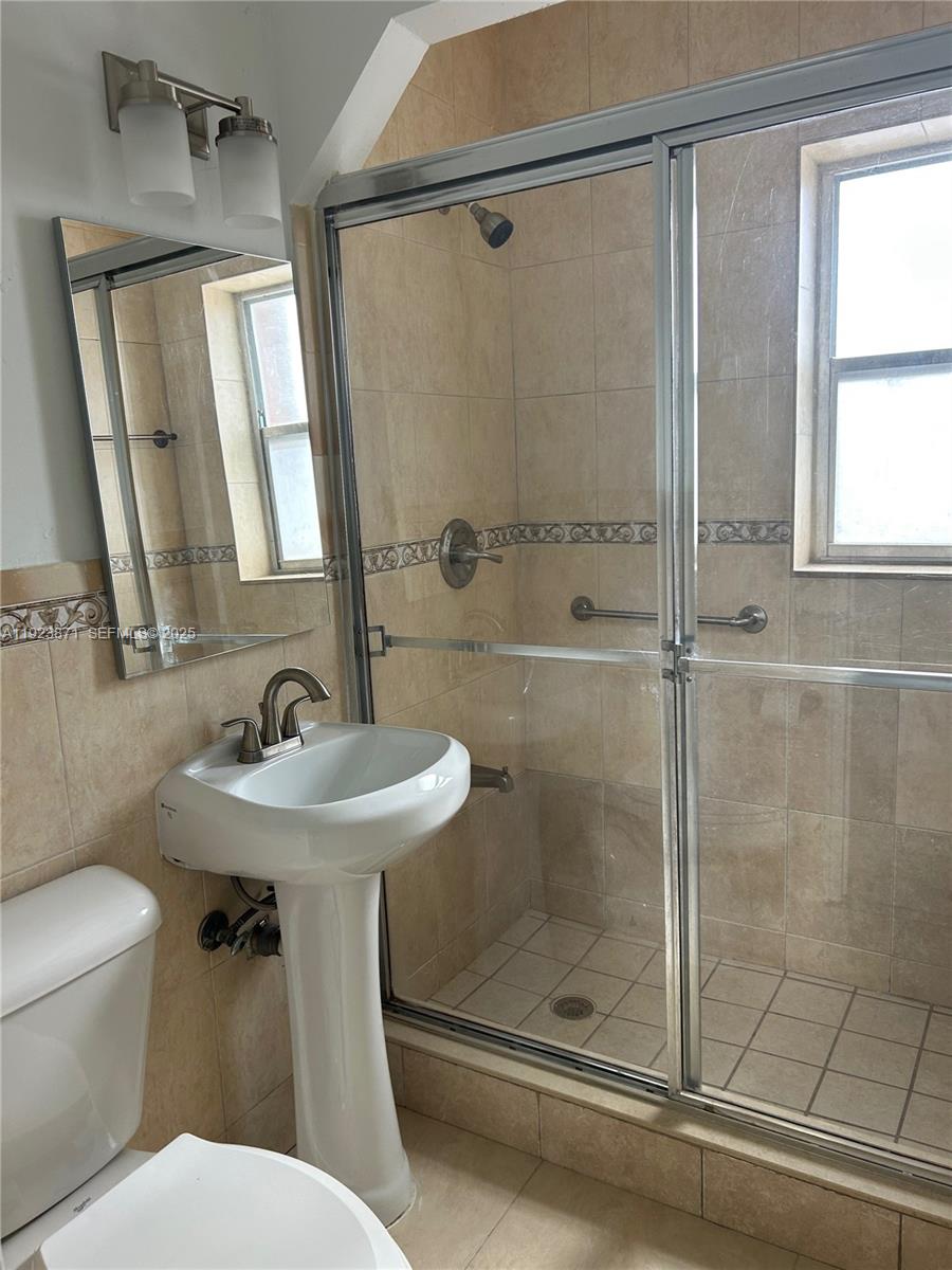 3400 Southwest 9th Terrace, Unit 2B Miami, FL 33135 - Photo 21 of 25 a bathroom with a sink toilet and shower