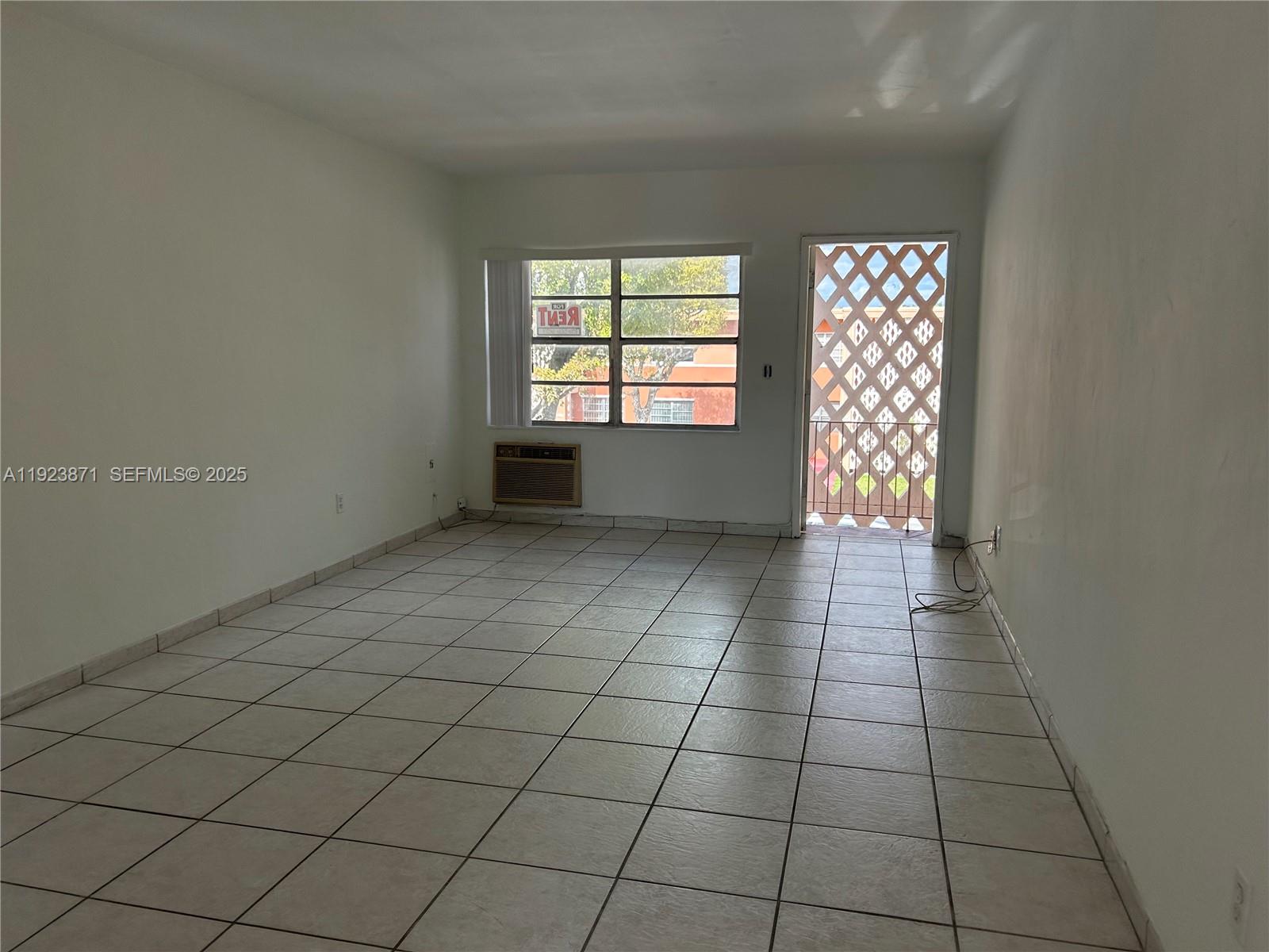 3400 Southwest 9th Terrace, Unit 2B Miami, FL 33135 - Photo 10 of 25 an empty room with windows