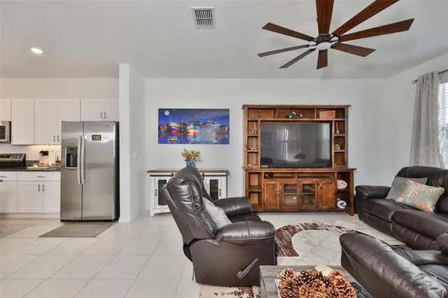 a kitchen with sink a counter space dining table and chairs
