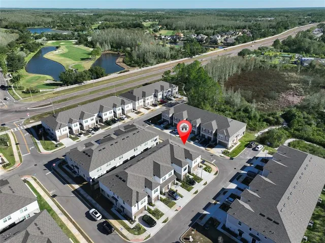 an aerial view of a house with a swimming pool
