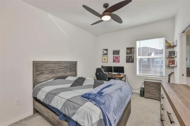 a bedroom with a bed and a chair