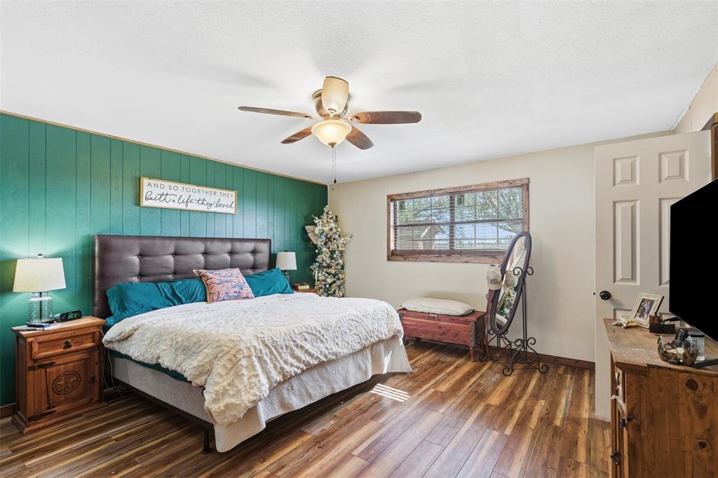 8145 Blair Road Northlake, TX 76247 - Photo 15 of 34 a bedroom with a bed and a flat screen tv