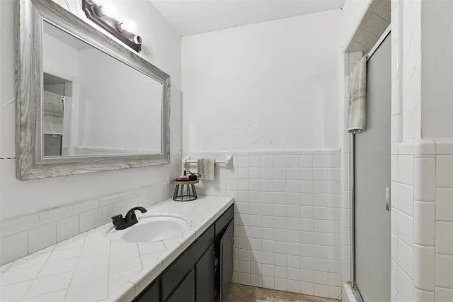 a bedroom with furniture and a wooden floor