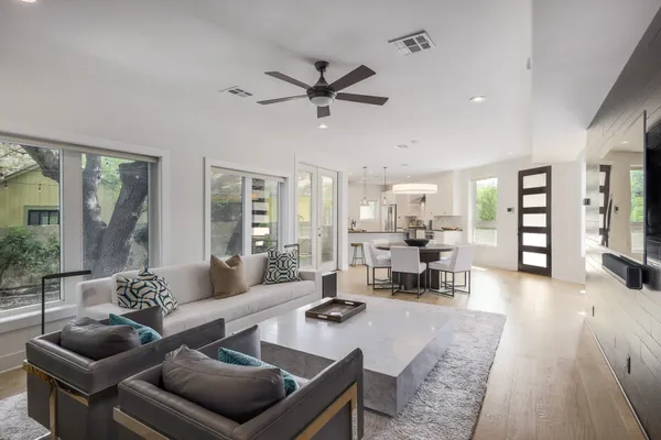 a living room with furniture and a large window