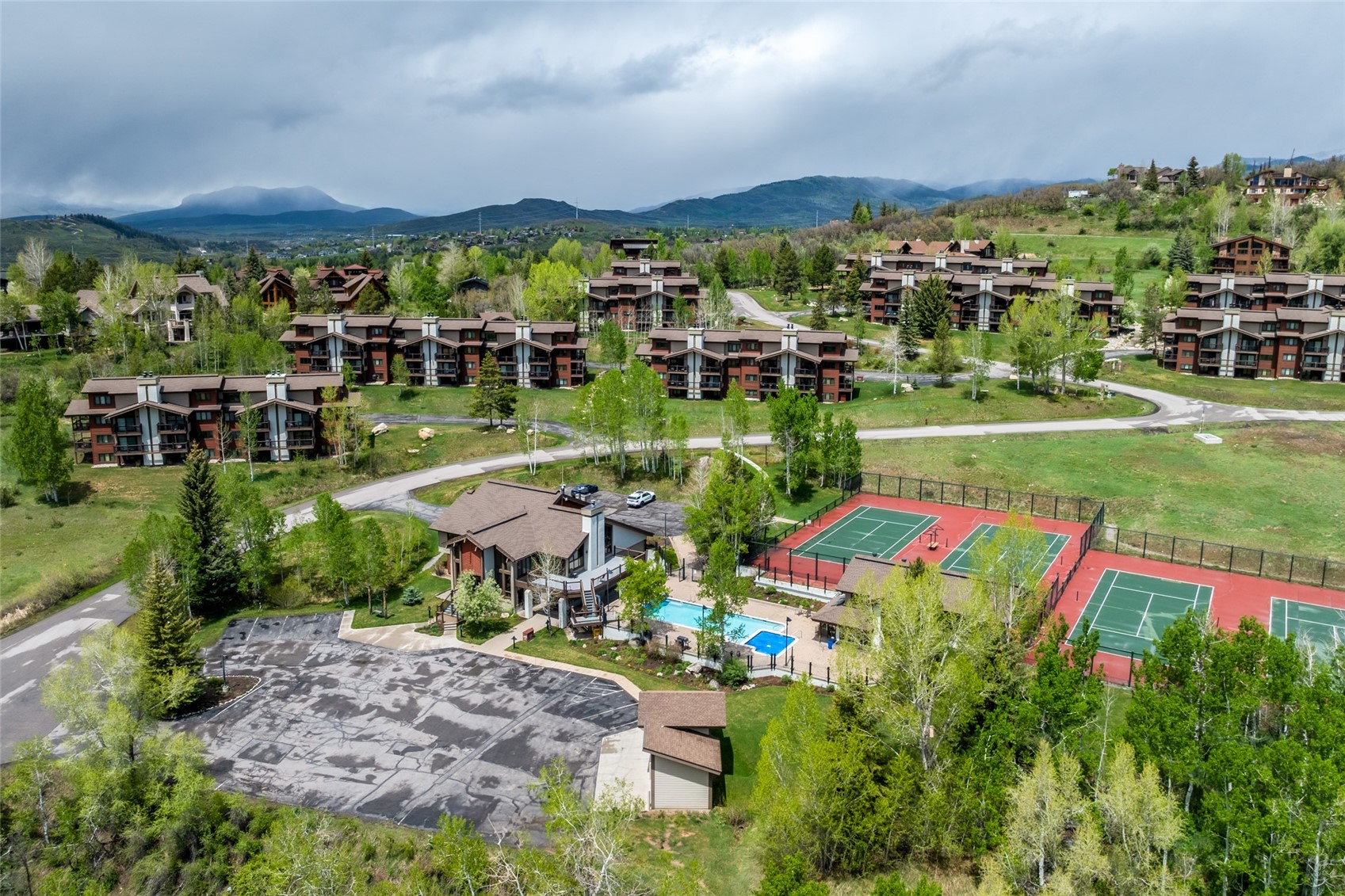 1655 Ranch Road, Unit 403 Steamboat Springs, CO 80487 - Photo 3 of 36 Bird's eye view of a mountainous background and a pool