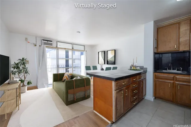 a spacious bathroom with a granite countertop double vanity and a mirror