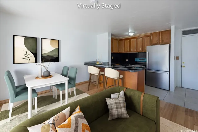 a kitchen with a table chairs refrigerator and a microwave