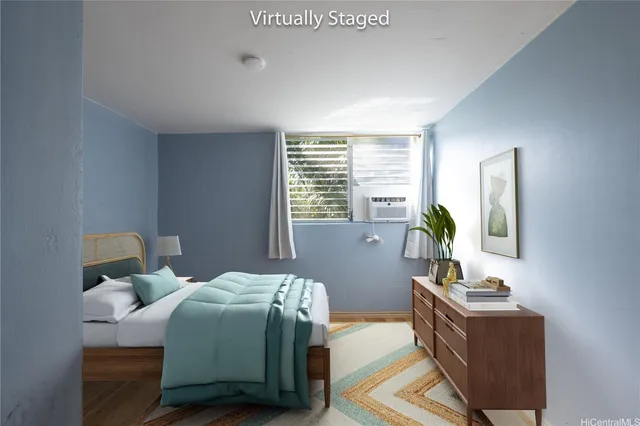 a bedroom with bed and a window