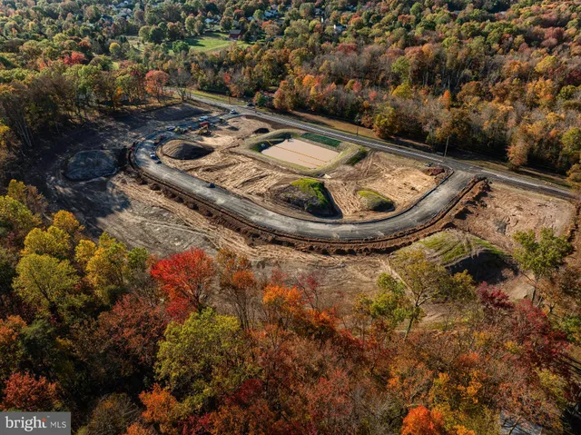 a view of a backyard with swimming pool