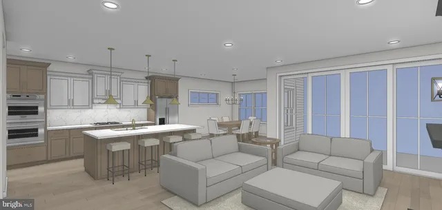 a living room with stainless steel appliances granite countertop furniture a couch and a view of kitchen