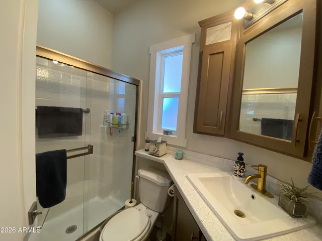 a dining room with furniture and a window