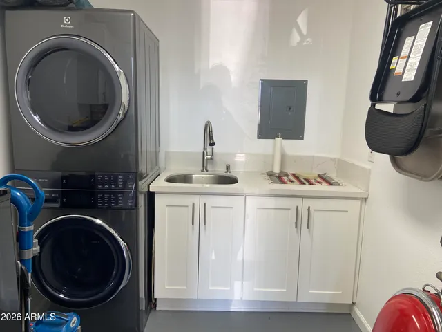 a view of a patio with table and chairs