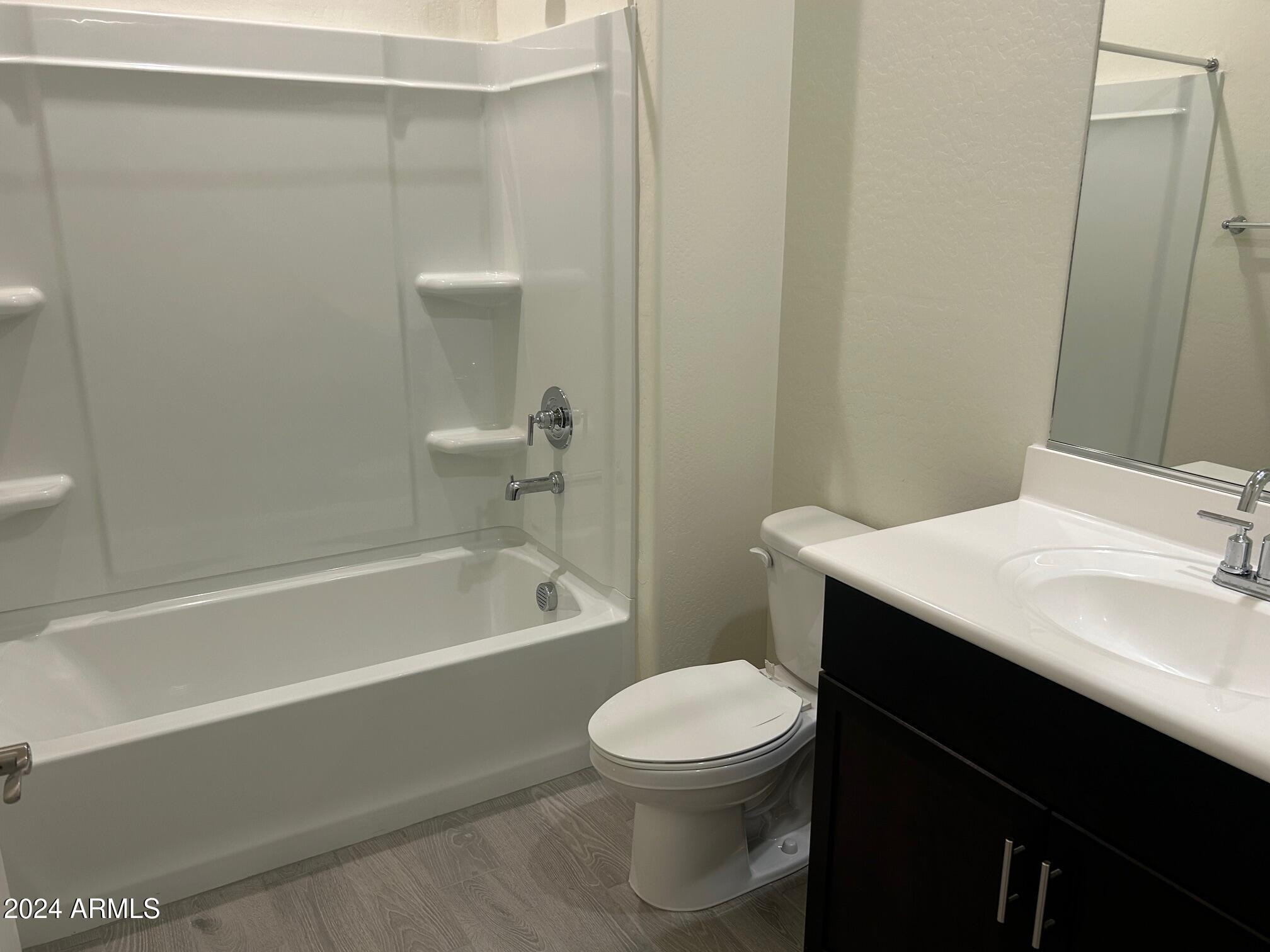 20520 North Candlelight Road Maricopa, AZ 85138 - Photo 11 of 18 a bathroom with a sink a toilet and shower