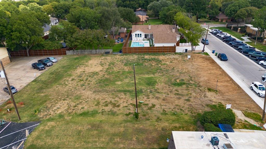 717 East Worth Street Grapevine, TX 76051 - Photo 3 of 18 a aerial view of a house with a yard