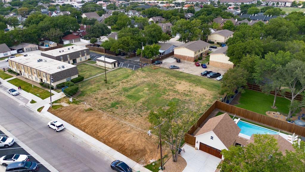 717 East Worth Street Grapevine, TX 76051 - Photo 7 of 18 an aerial view of a house with a garden and lake view