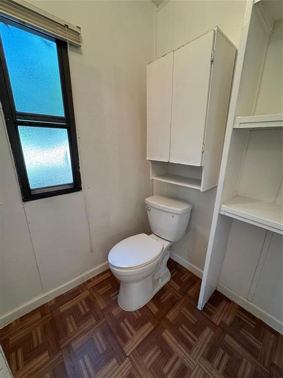 2010 Spring Court Azle, TX 76020 - Photo 12 of 19 a bathroom with a toilet and a mirror