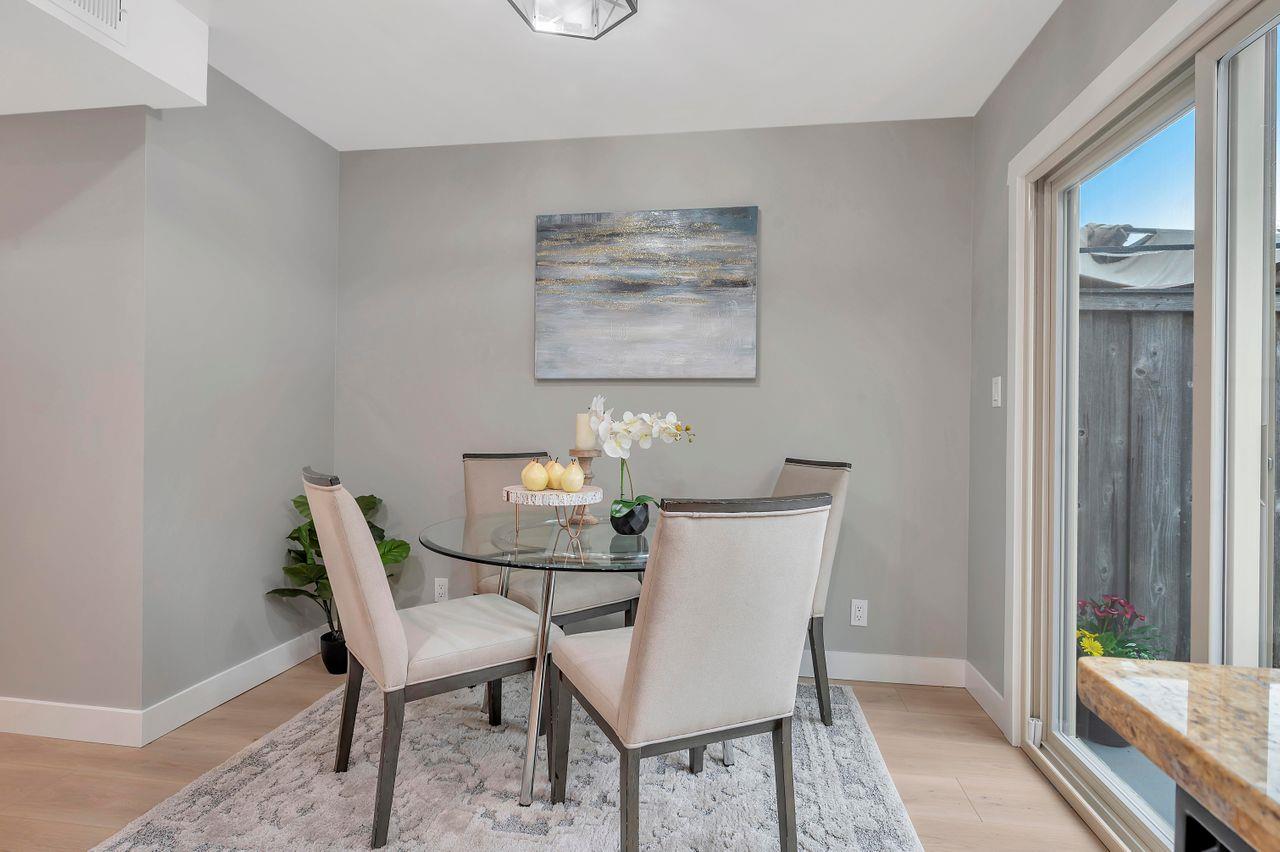 1181 Oddstad Boulevard Pacifica, CA 94044 - Photo 13 of 35 a view of a dining room with furniture and wooden floor