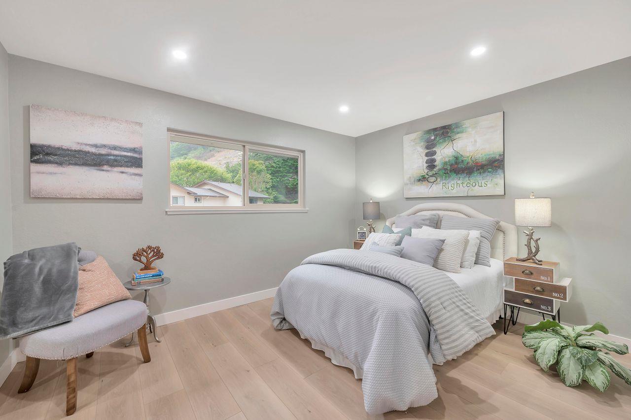 1181 Oddstad Boulevard Pacifica, CA 94044 - Photo 17 of 35 a bedroom with a bed and window