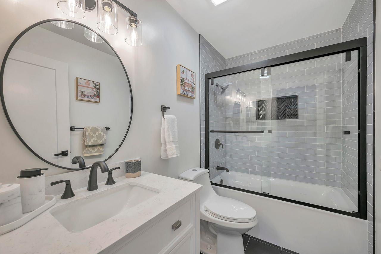 1181 Oddstad Boulevard Pacifica, CA 94044 - Photo 26 of 35 a bathroom with a sink a toilet and shower