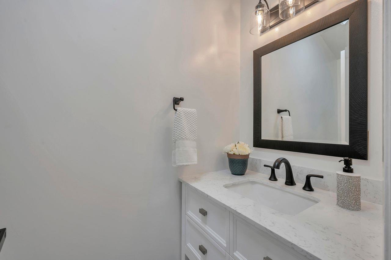 1181 Oddstad Boulevard Pacifica, CA 94044 - Photo 27 of 35 a bathroom with a sink and a mirror