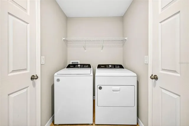 a utility room with dryer and washer