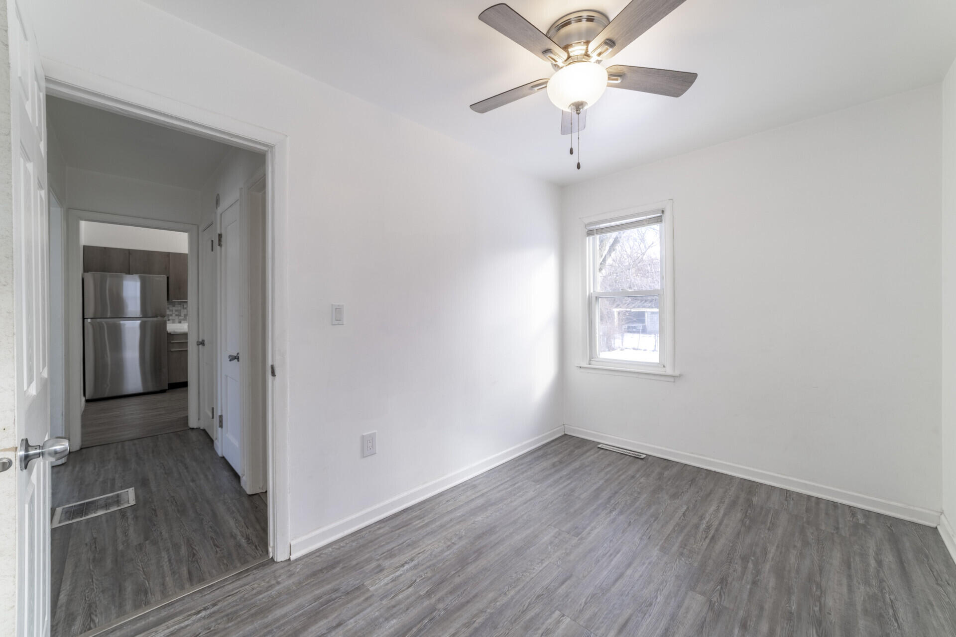 2267 Tennessee Street Gary, IN 46407 - Photo 13 of 22 wooden floor in an empty room with a window