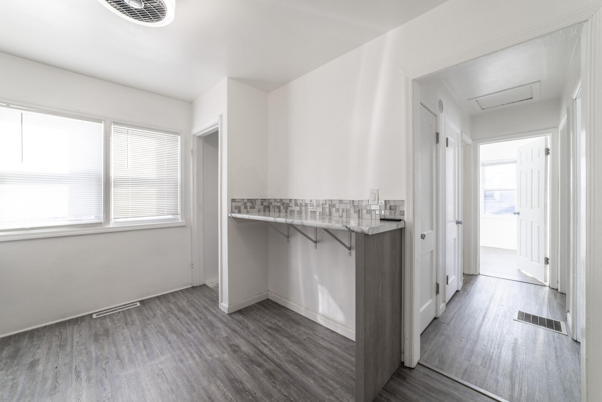2267 Tennessee Street Gary, IN 46407 - Photo 17 of 22 a hallway with wooden floor and cabinet