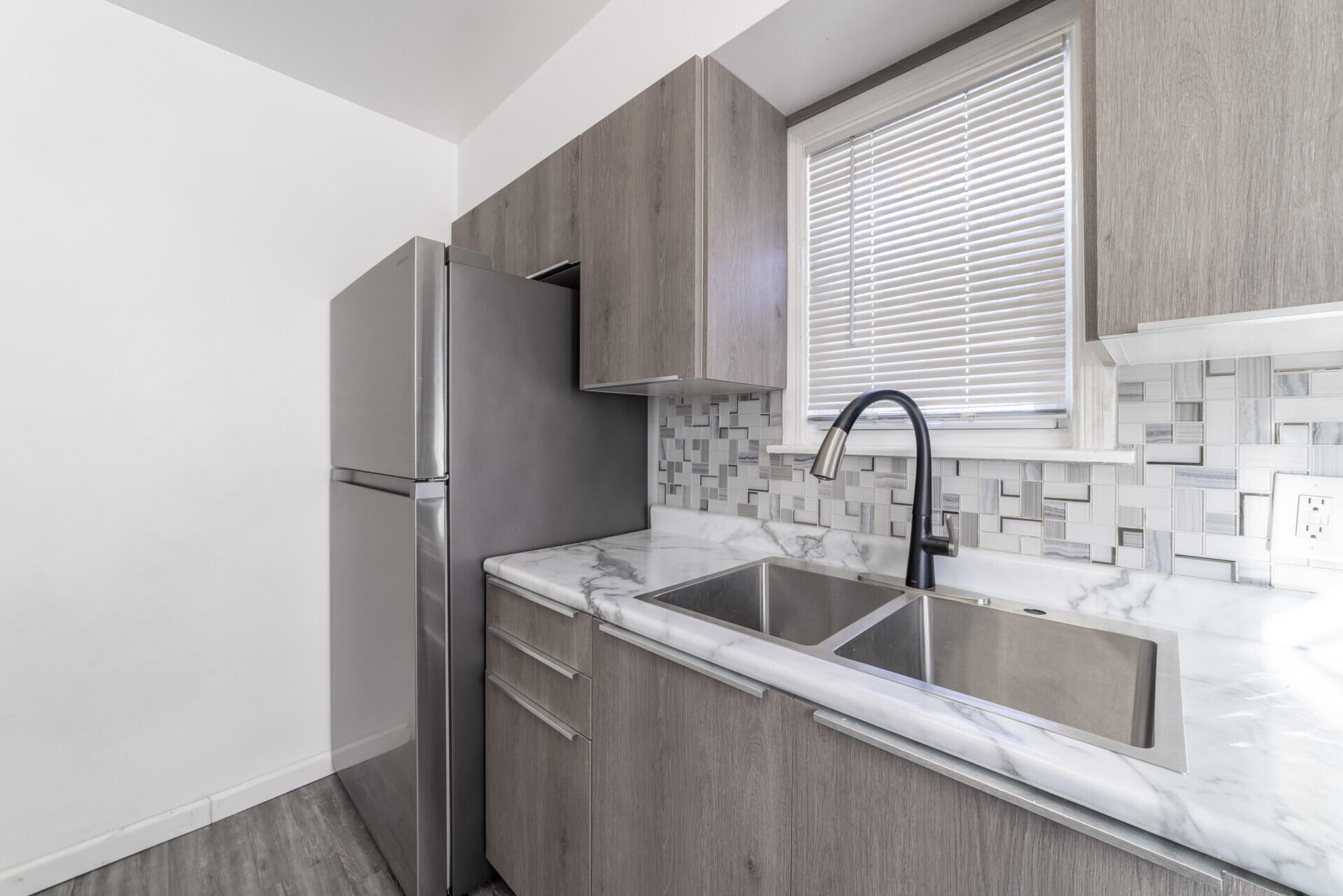 2267 Tennessee Street Gary, IN 46407 - Photo 8 of 22 a close view of a sink and a refrigerator