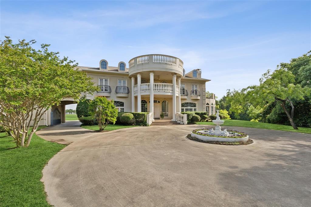 800 John McCain Road Colleyville, TX 76034 - Photo 12 of 38 a front view of a house with a garden