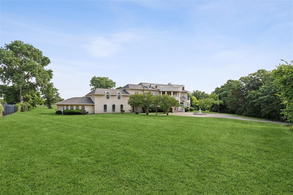 800 John McCain Road Colleyville, TX 76034 - Photo 13 of 38 a view of a big yard with plants and large trees