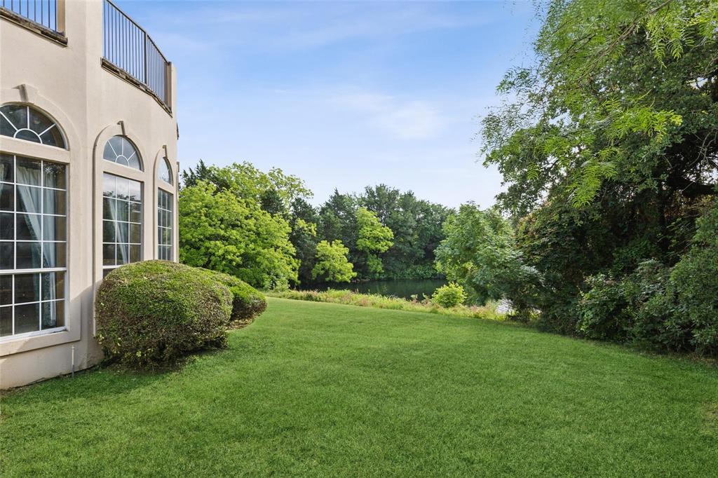 800 John McCain Road Colleyville, TX 76034 - Photo 14 of 38 a view of a garden in front of a house