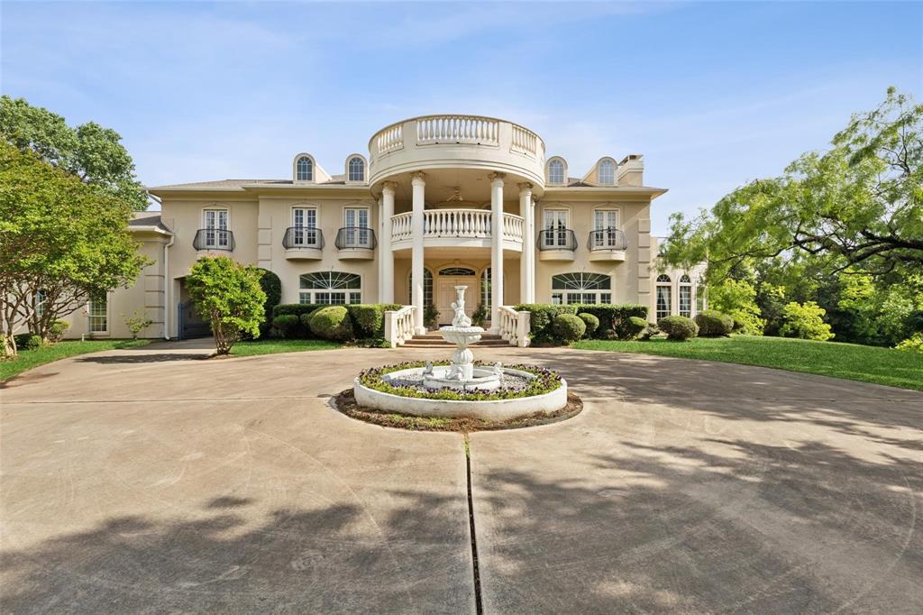800 John McCain Road Colleyville, TX 76034 - Photo 18 of 38 a front view of a house with a garden