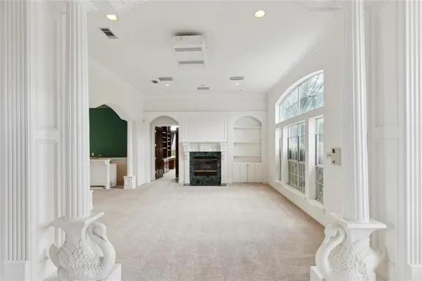 a view of an empty room with windows