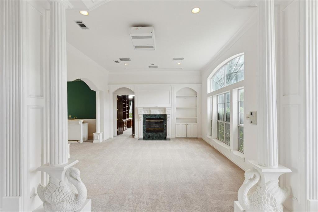 800 John McCain Road Colleyville, TX 76034 - Photo 21 of 38 a view of a livingroom with a fireplace cabinet and window