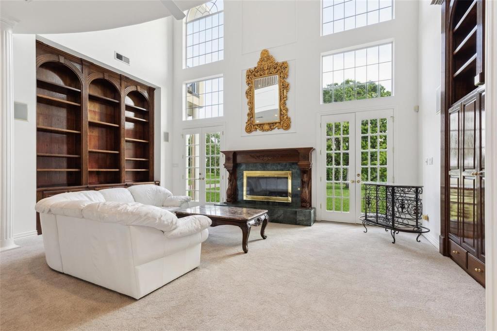 800 John McCain Road Colleyville, TX 76034 - Photo 25 of 38 a living room with furniture windows and a fireplace
