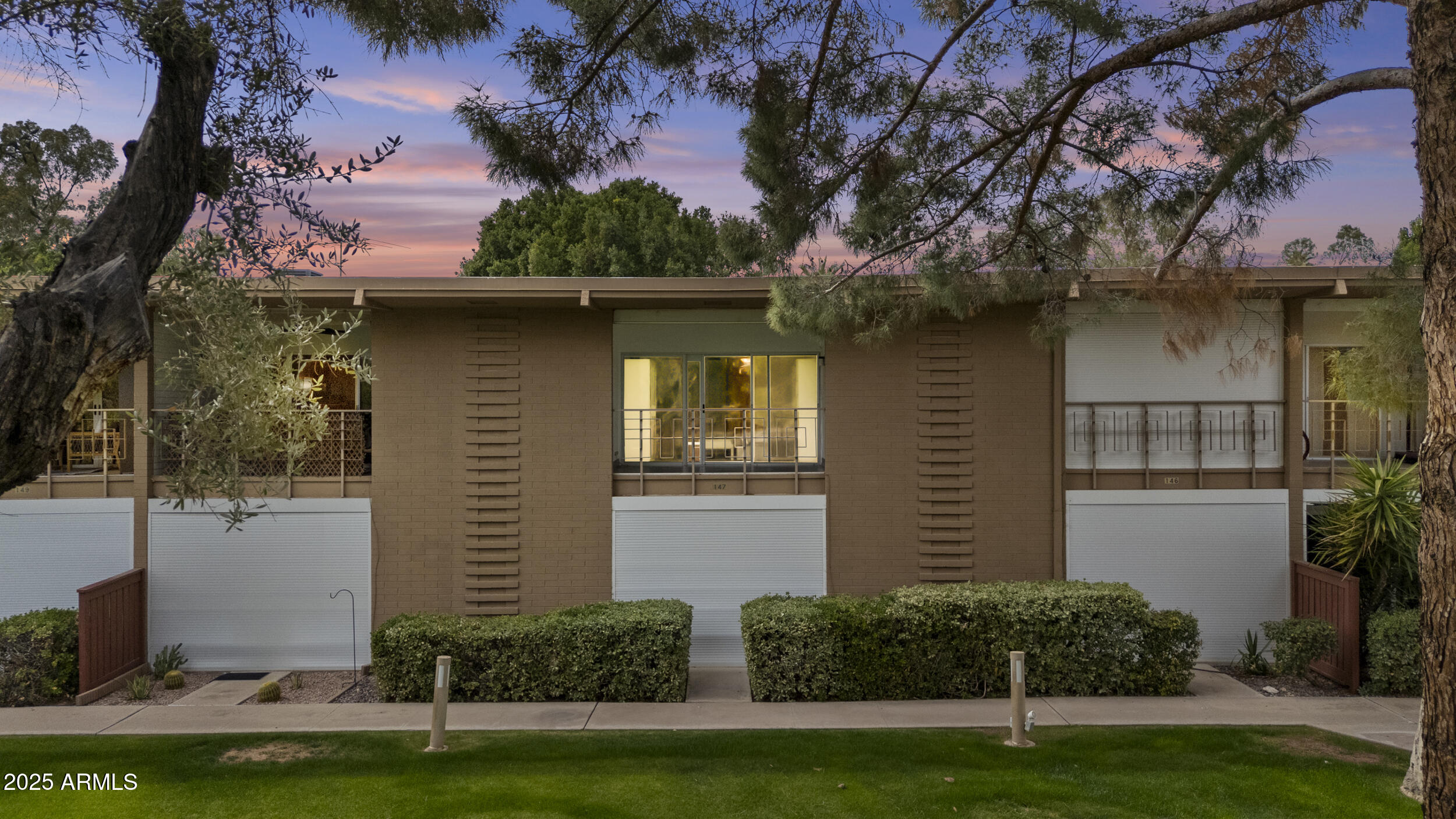 6125 East Indian School Road, Unit 247 Scottsdale, AZ 85251 - Photo 2 of 13 a front view of a house with garden
