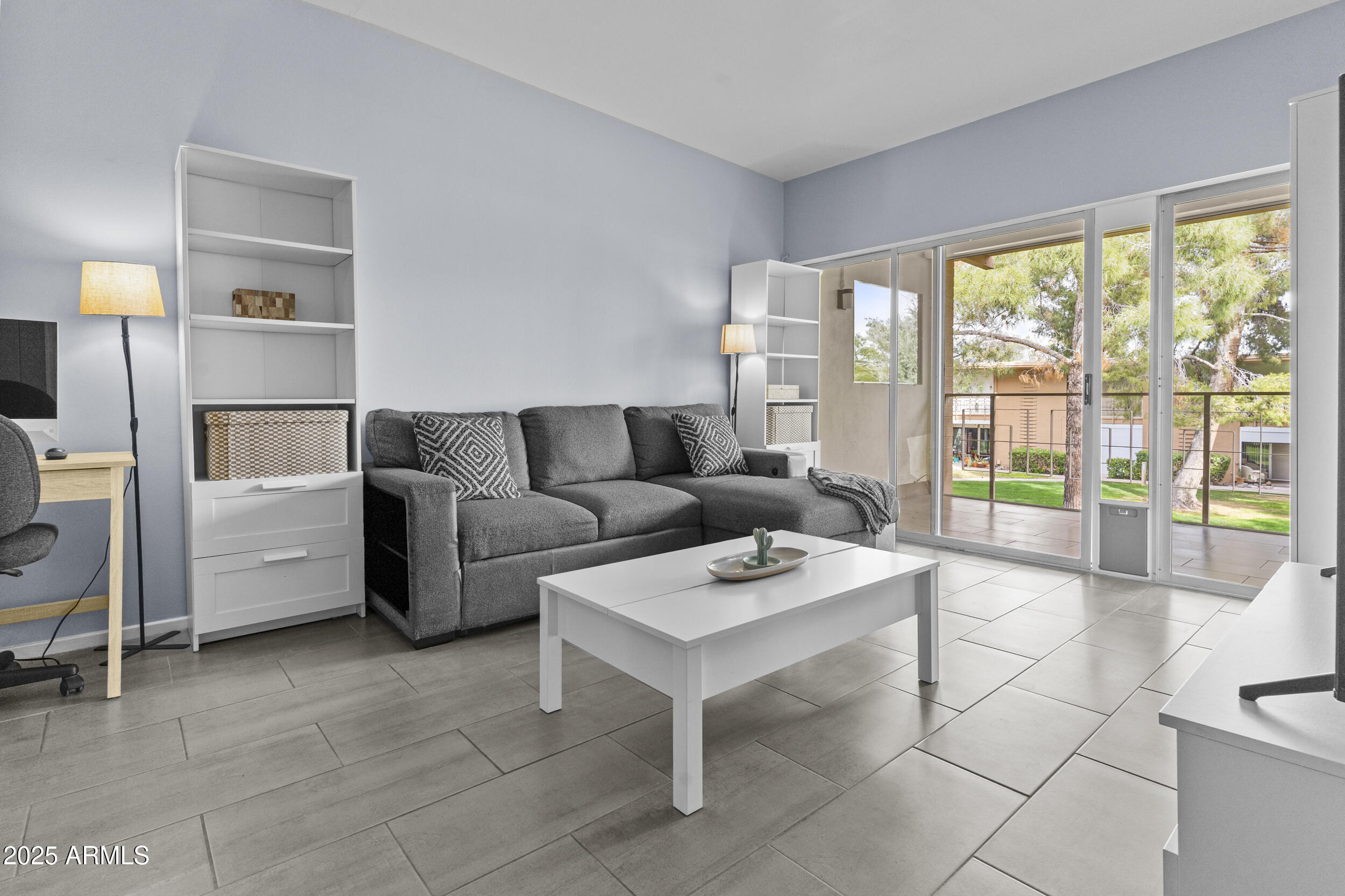6125 East Indian School Road, Unit 247 Scottsdale, AZ 85251 - Photo 3 of 13 a living room with furniture and a large window