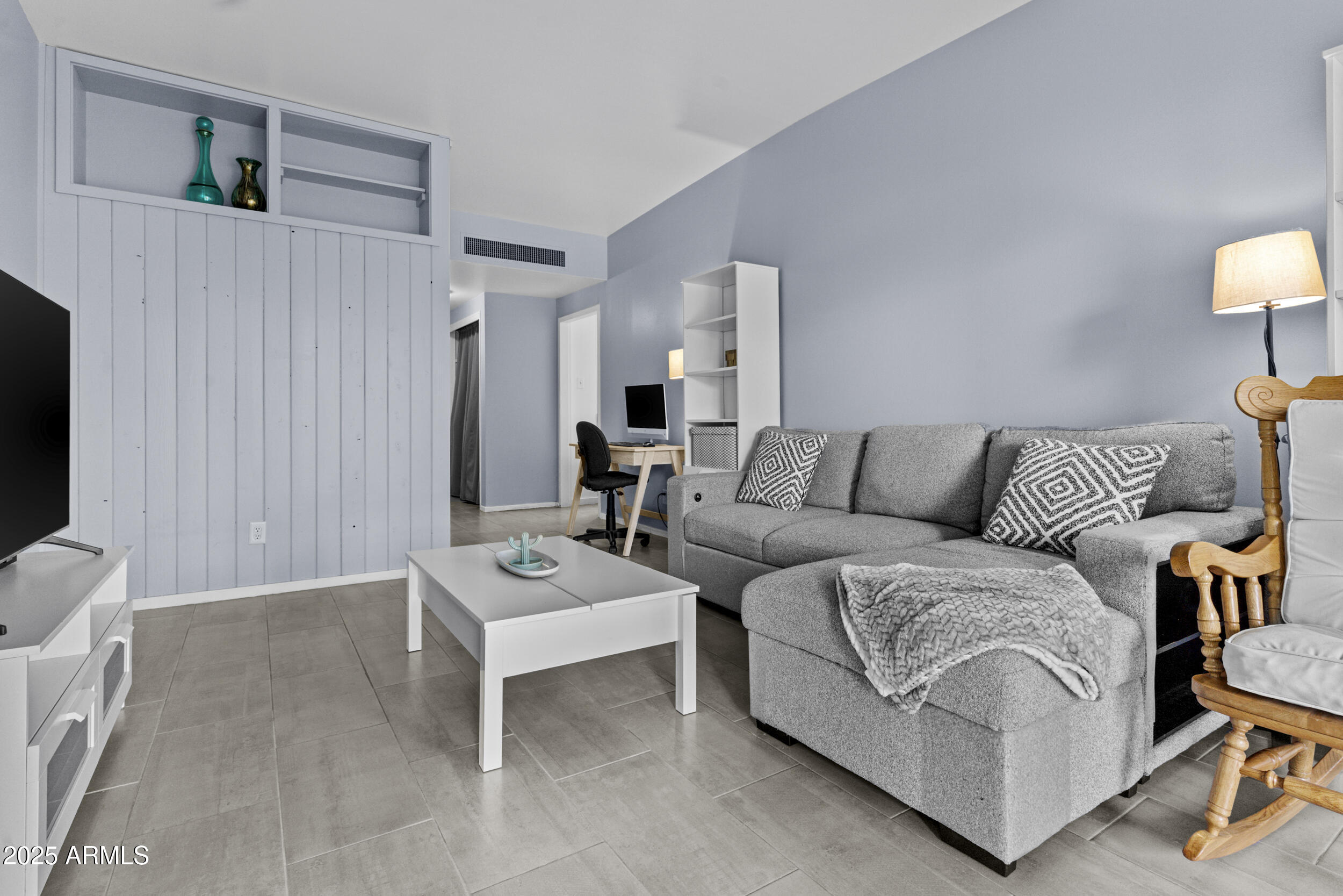 6125 East Indian School Road, Unit 247 Scottsdale, AZ 85251 - Photo 6 of 13 a living room with furniture and a couch