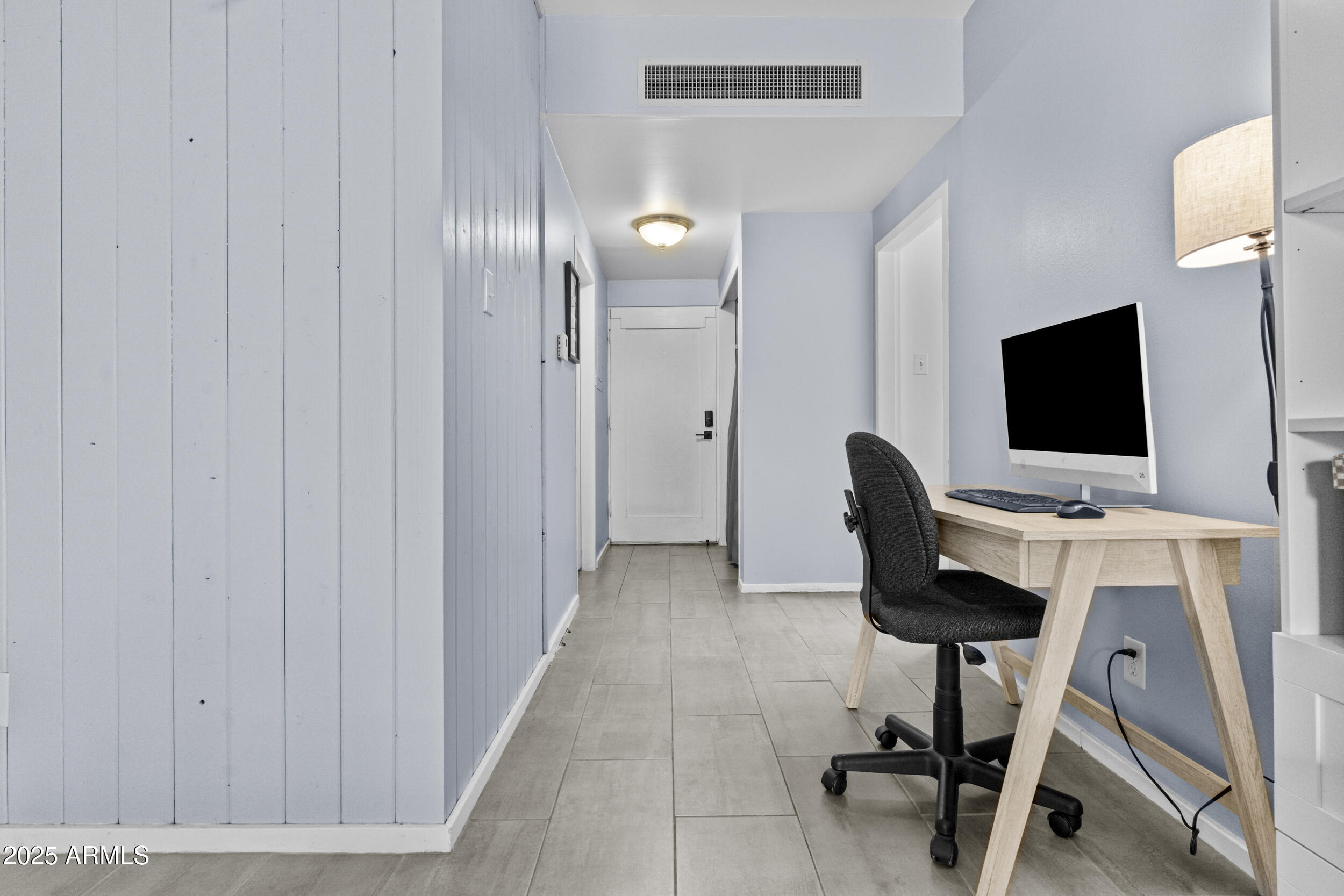 6125 East Indian School Road, Unit 247 Scottsdale, AZ 85251 - Photo 7 of 13 a view of a workspace with furniture and a window