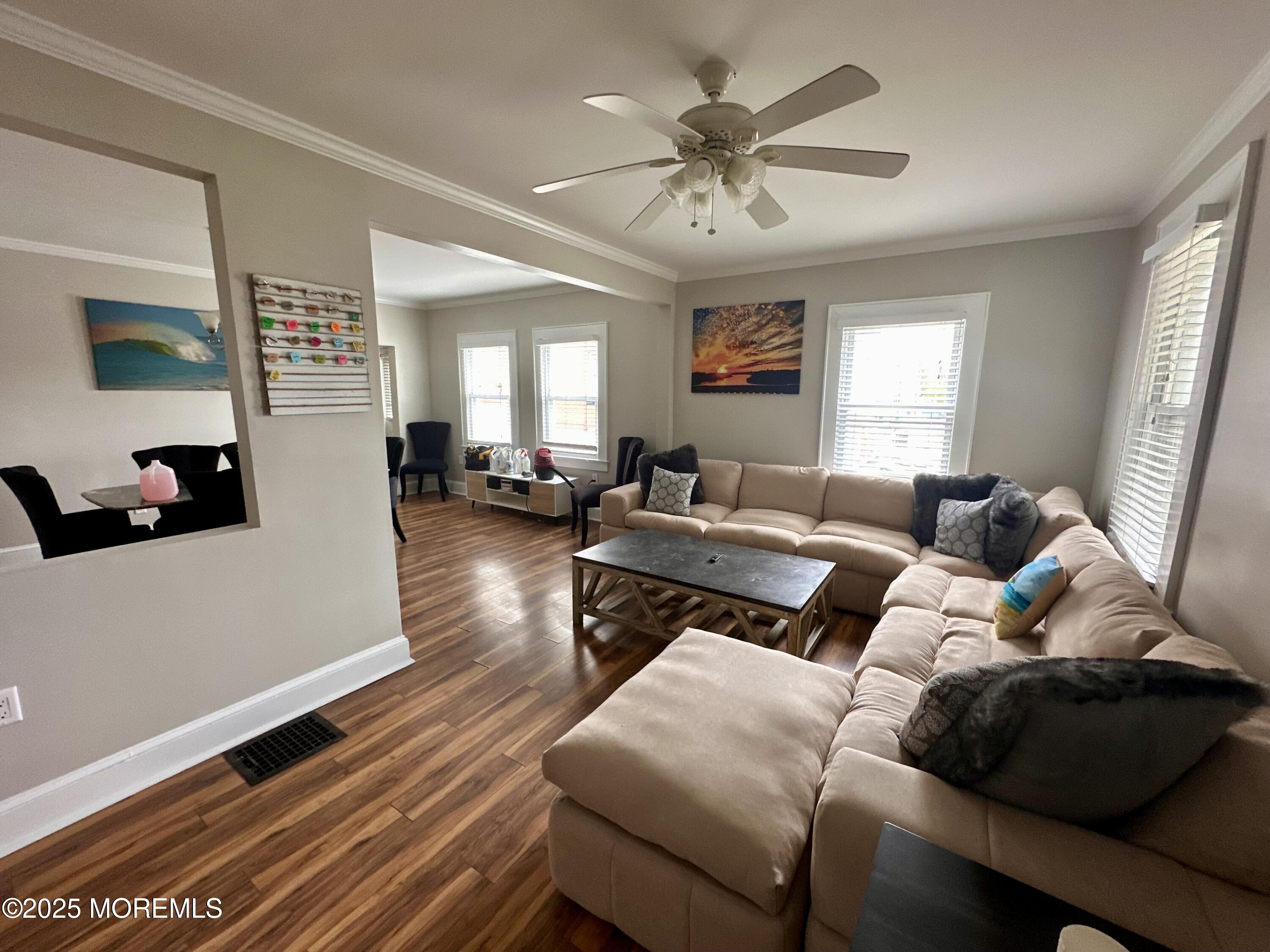 612 Sylvania Avenue Avon-by-the-Sea, NJ 07717 - Photo 15 of 17 a living room with furniture and wooden floor
